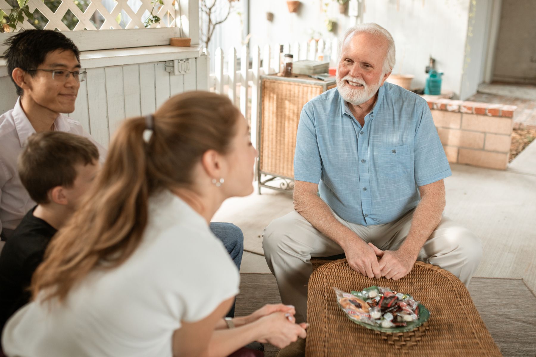 An older man enjoying time with his family